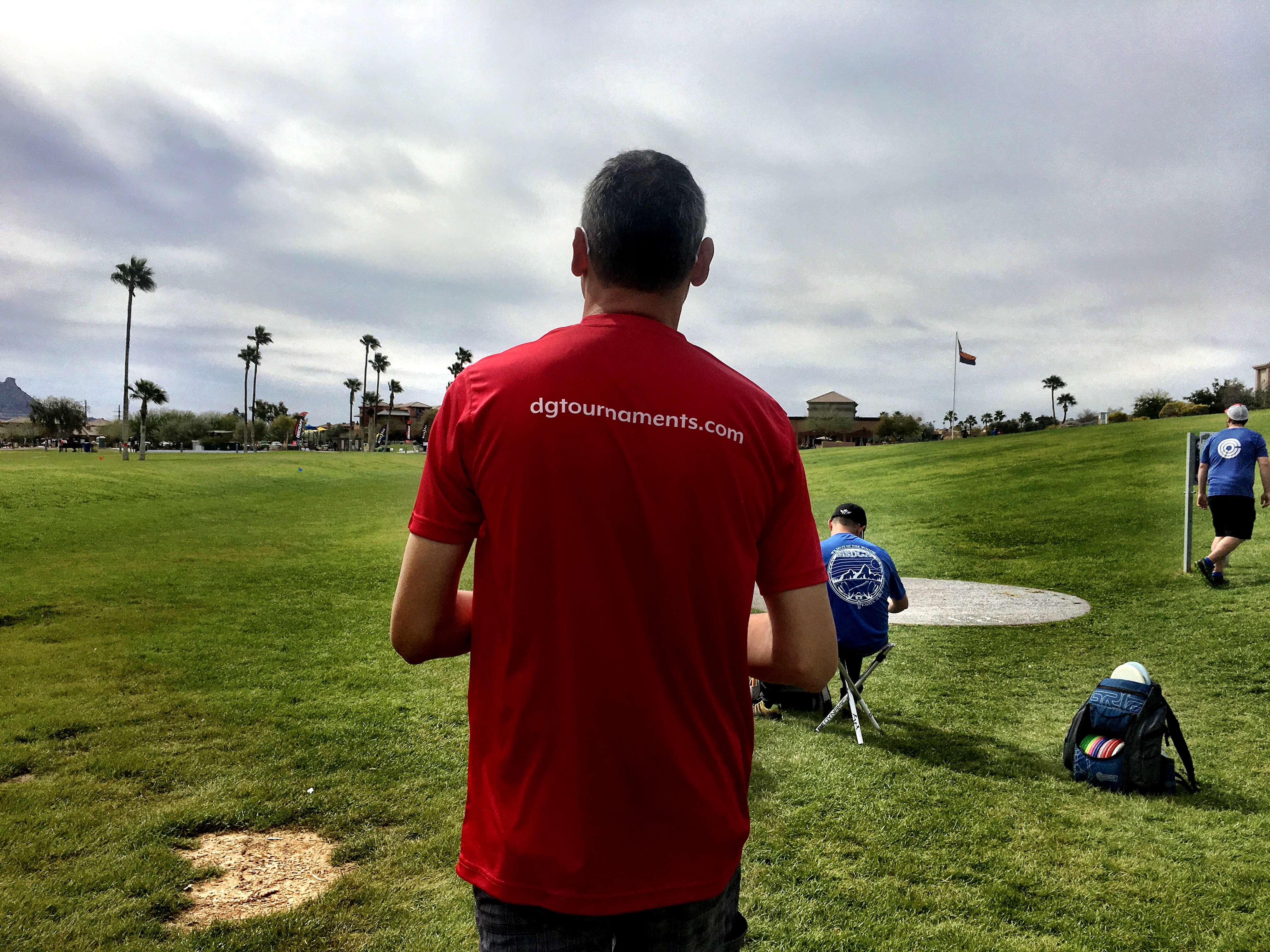 Phil wearing DG Tournaments shirt at a course