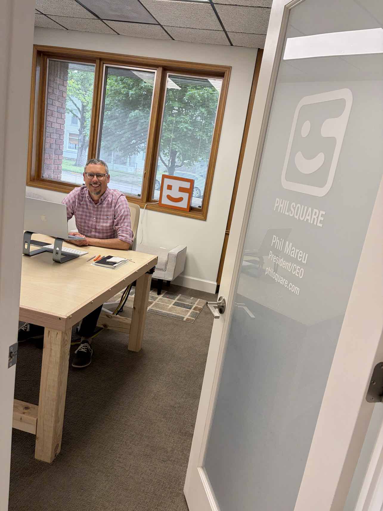 Phil at his desk in the Philsquare office