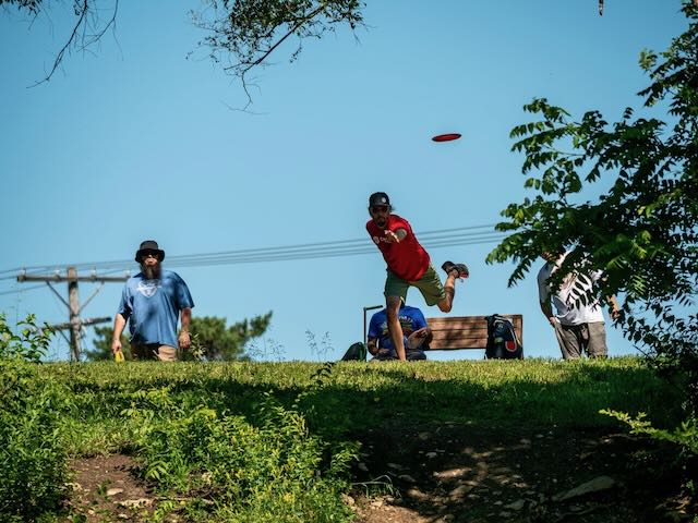 Phil throwing at a disc golf tournament